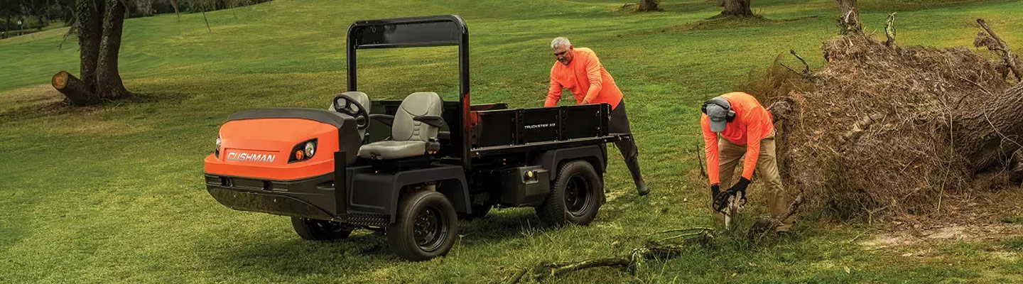 Men working with Cushman equipment