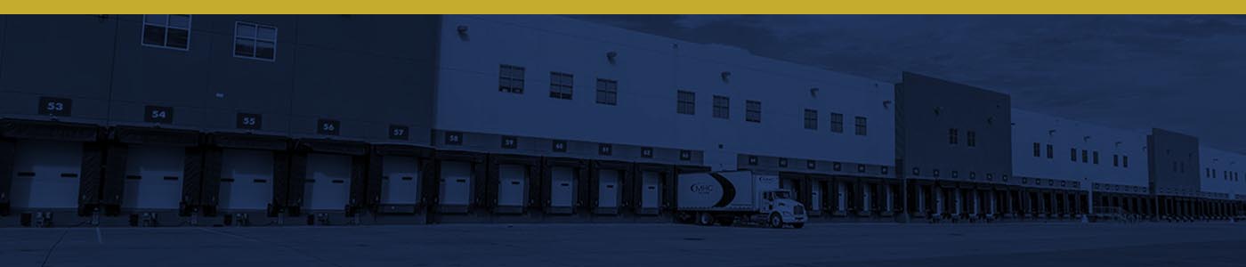 Burwell Material Handling distribution center with multiple loading docks and a delivery truck at the facility.